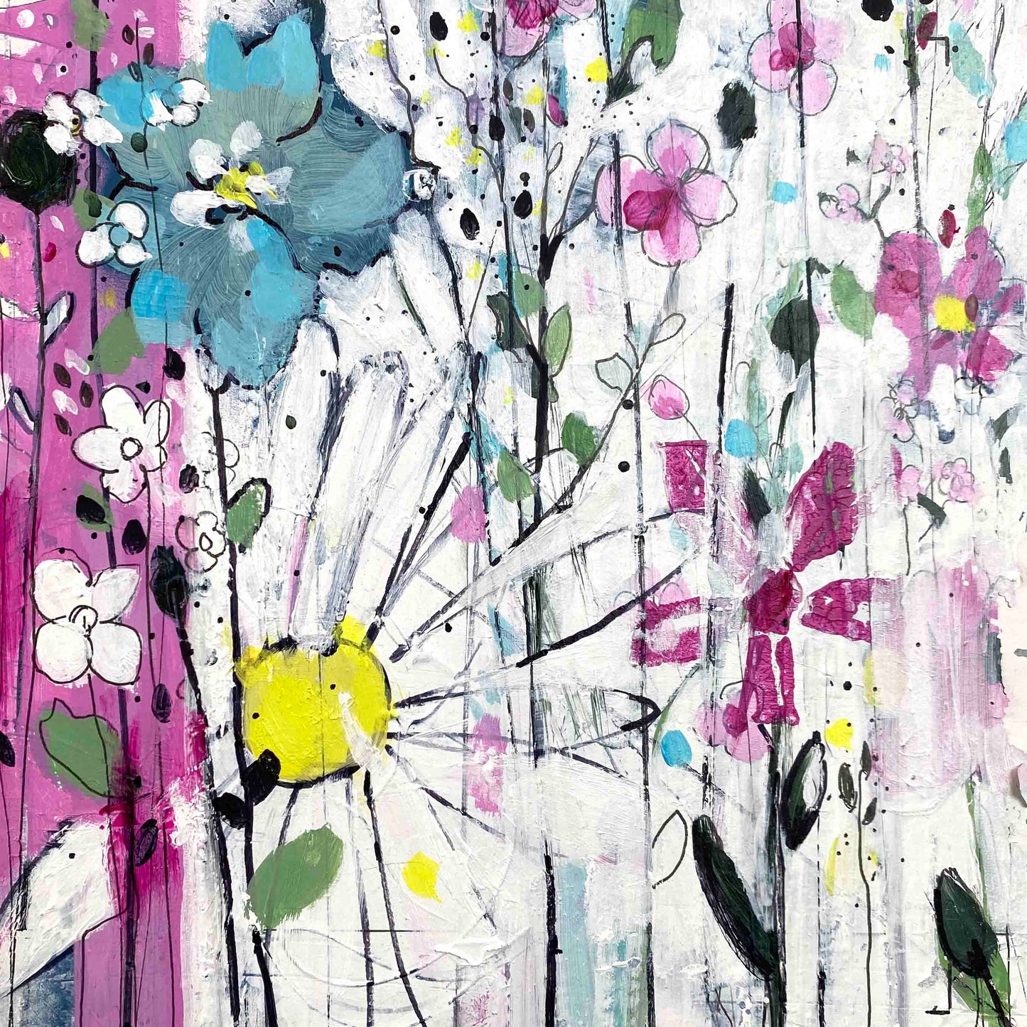 Flowers within the blades of grass