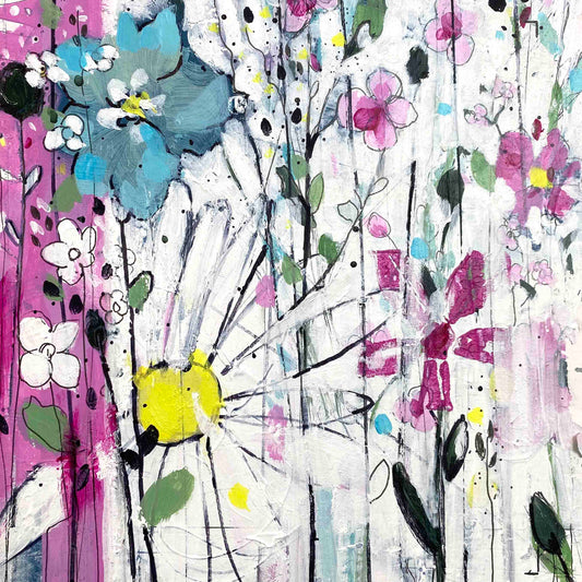 Flowers within the blades of grass