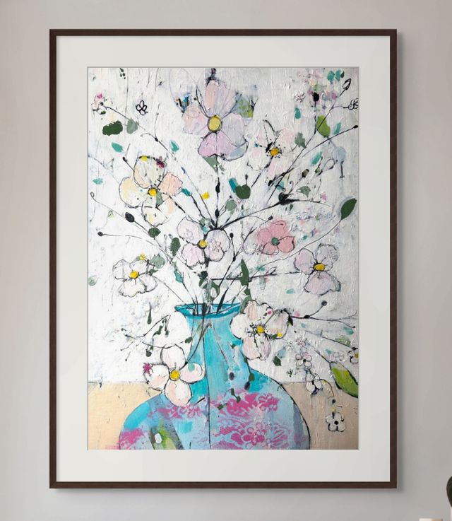 Delicate flowers in blue and pink vase