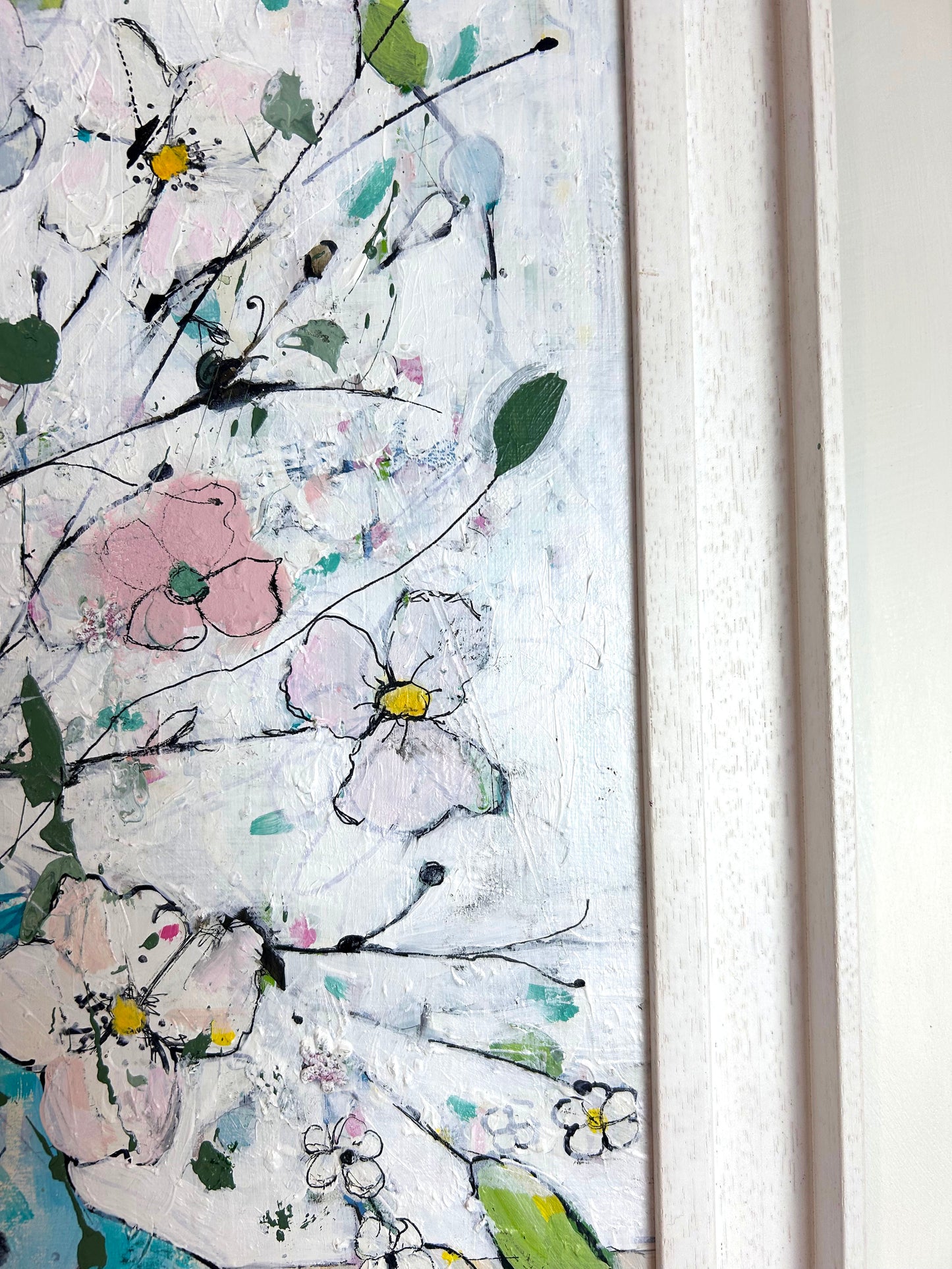 Delicate flowers in blue and pink vase