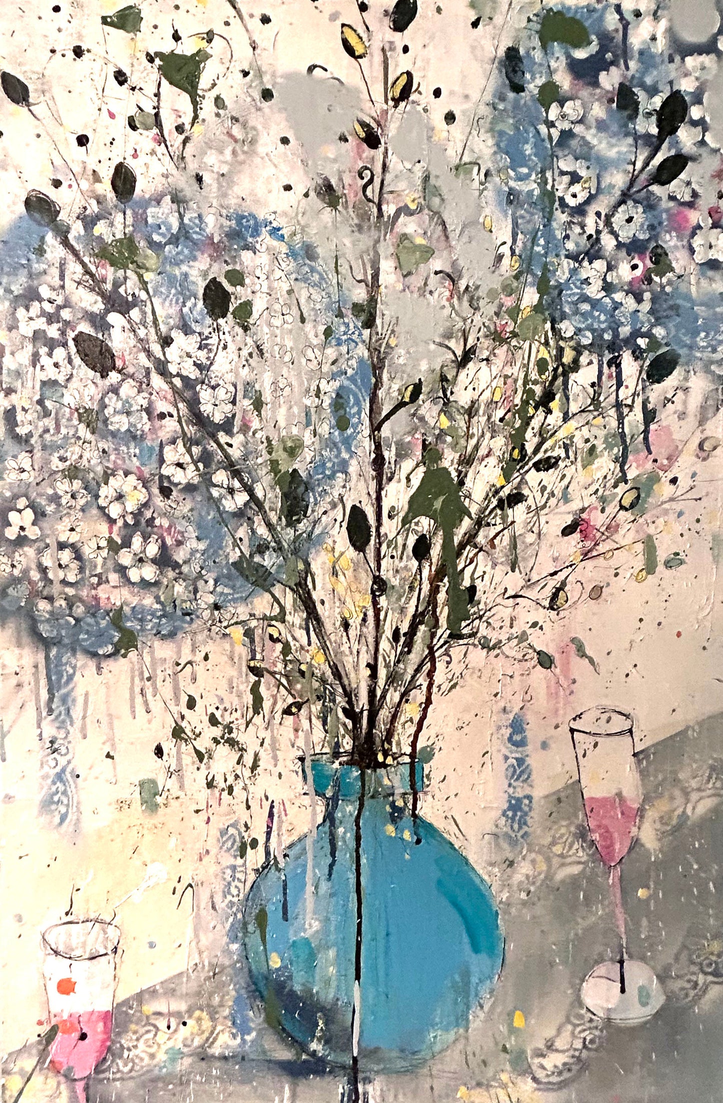 Hydrangeas in a blue vase and pink champagne