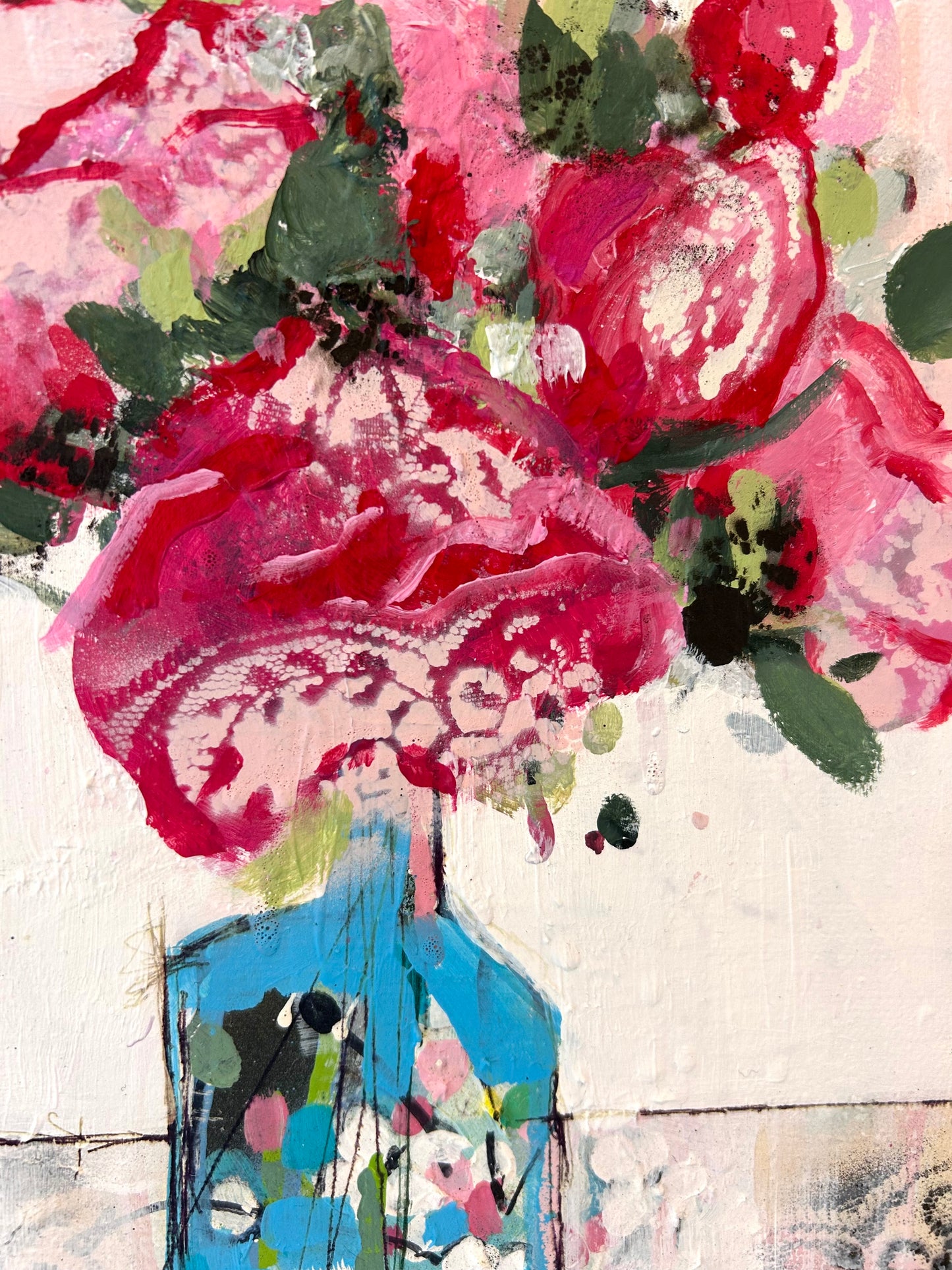 Peonies in a small blue vase