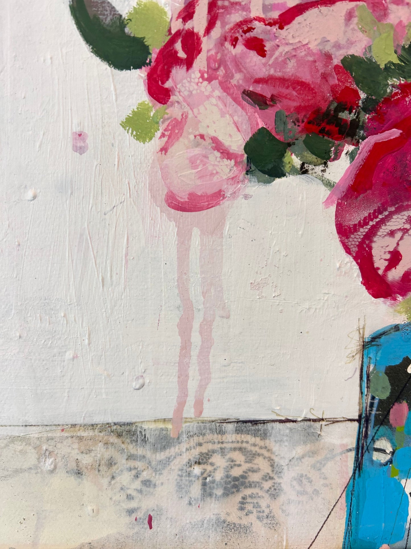 Peonies in a small blue vase
