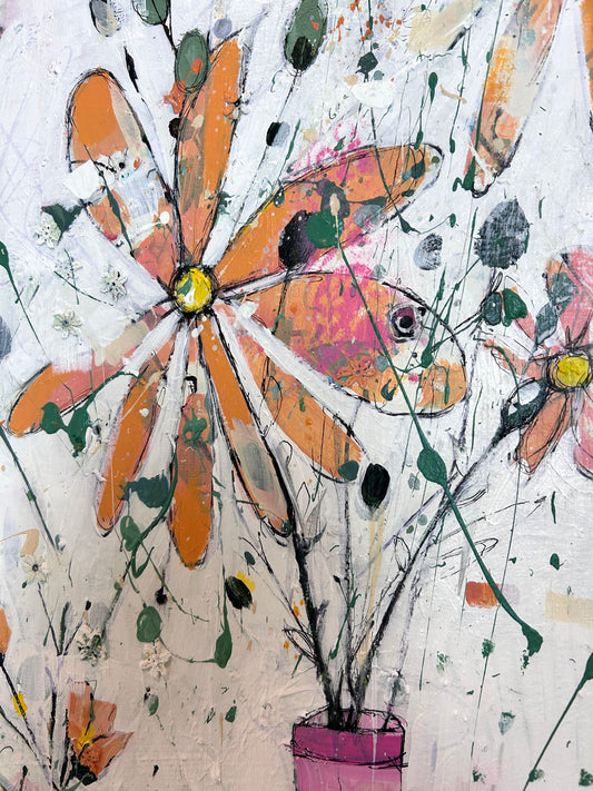 Orange flowers in pink vases