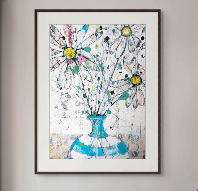 Daisies in blue and white stripped vase