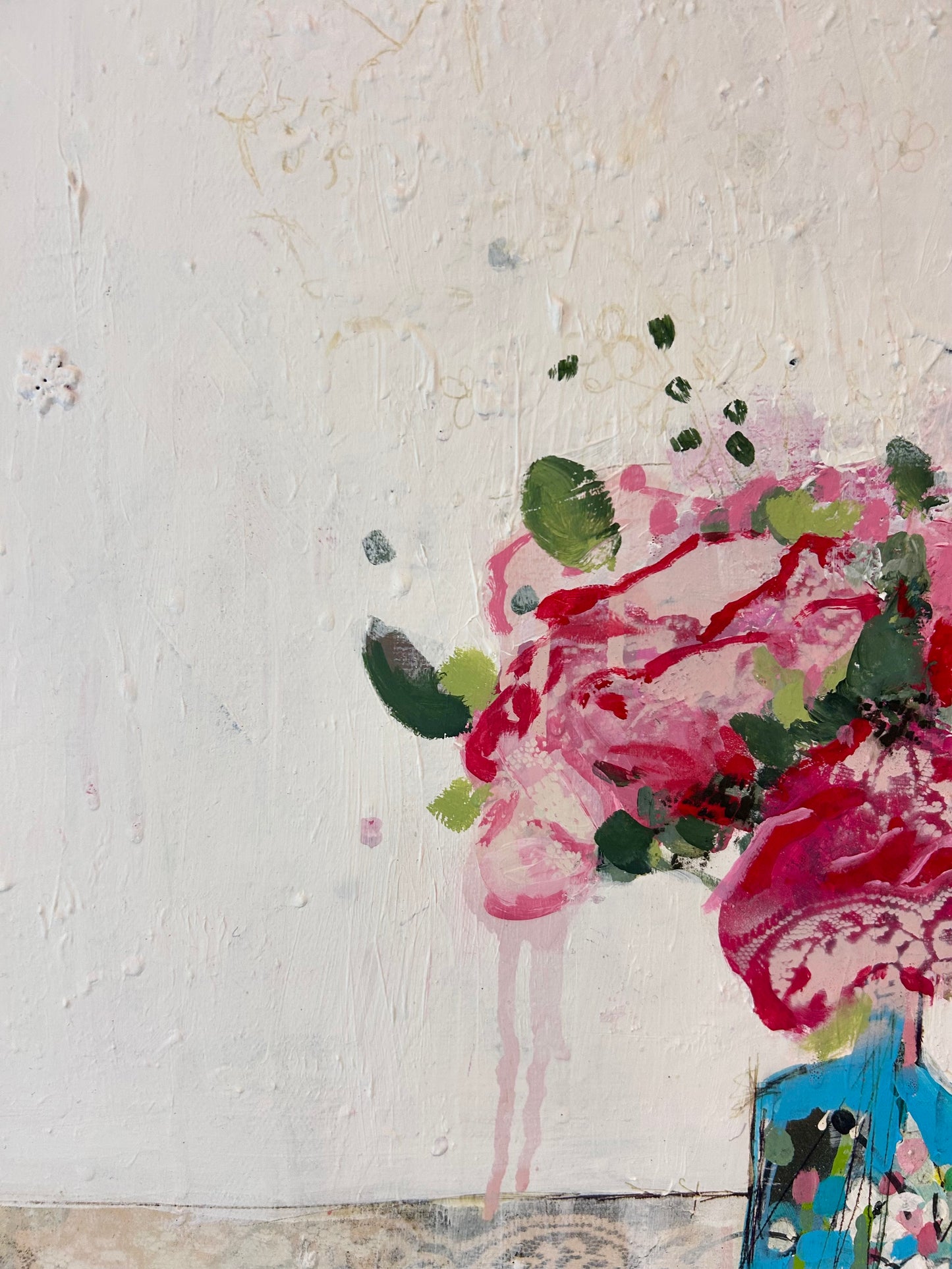 Peonies in a small blue vase