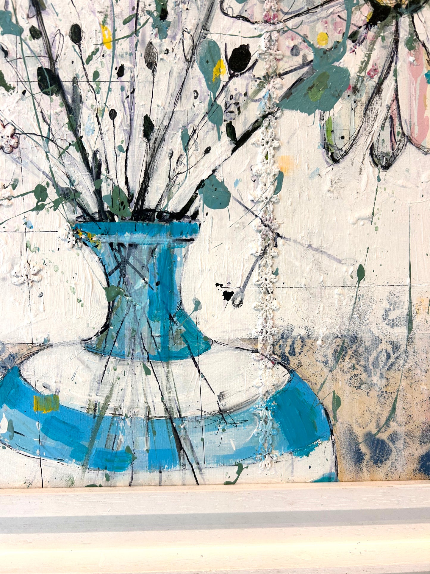 Daisies in blue stripped vase