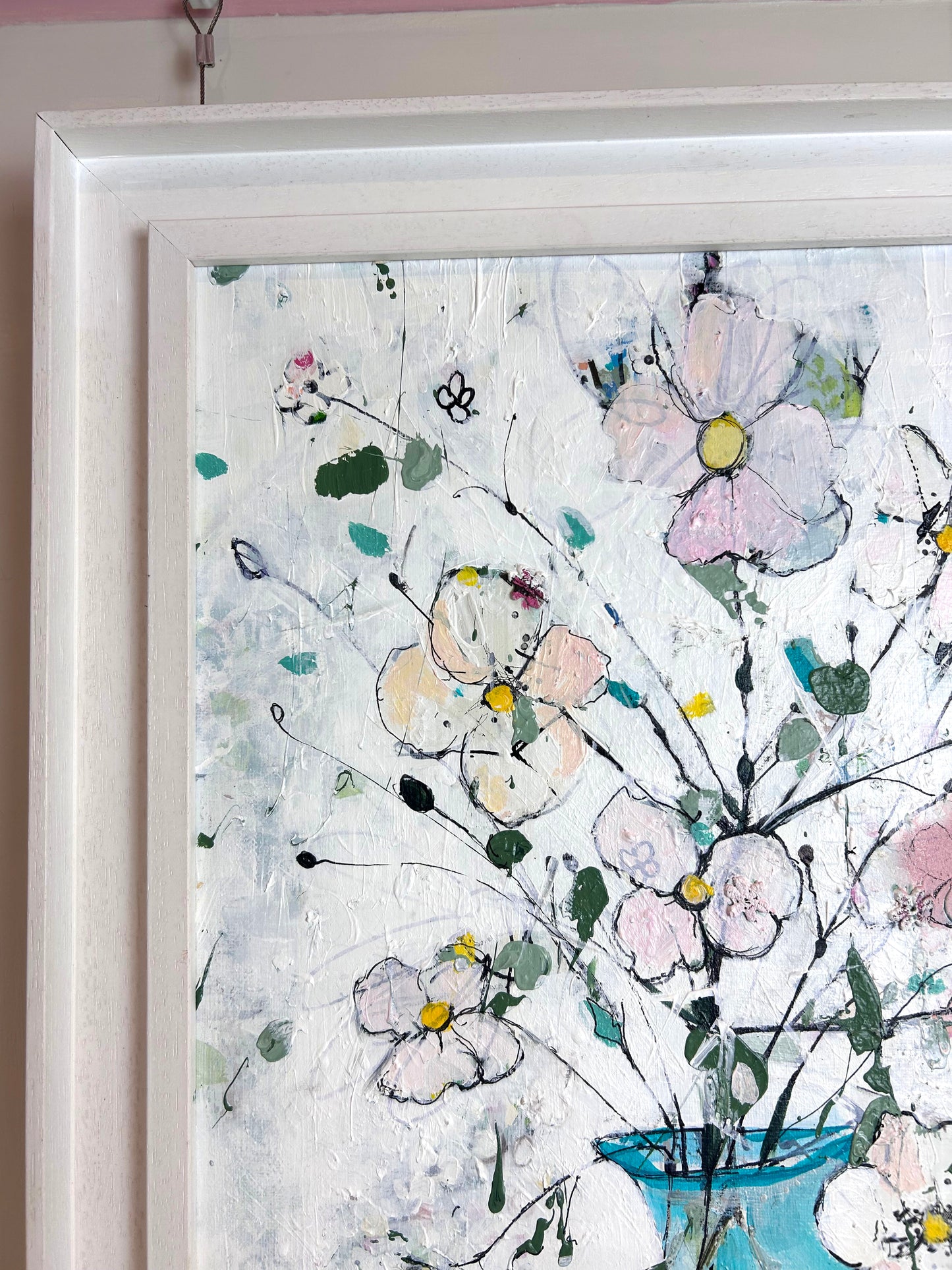 Delicate flowers in blue and pink vase