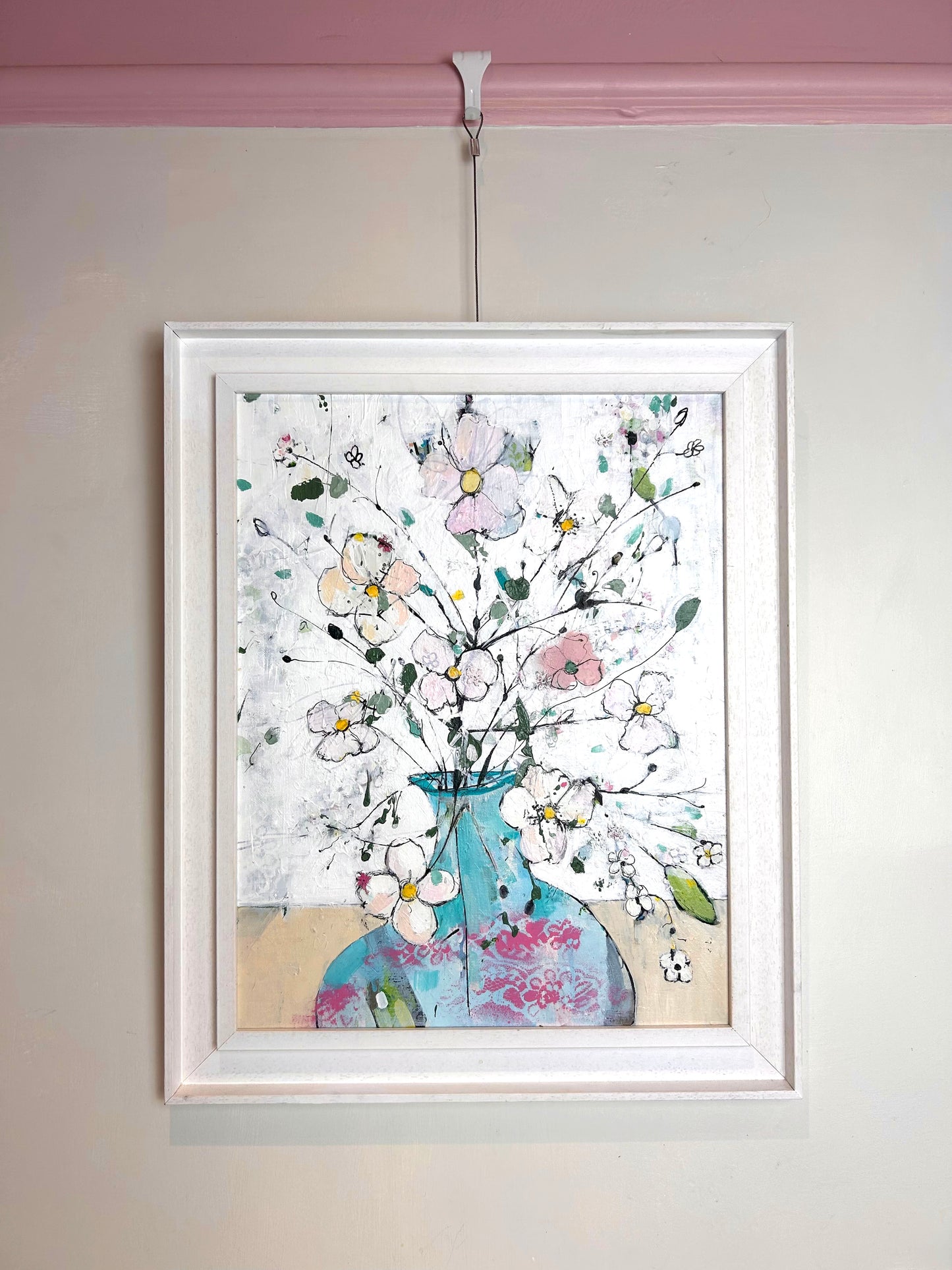 Delicate flowers in blue and pink vase